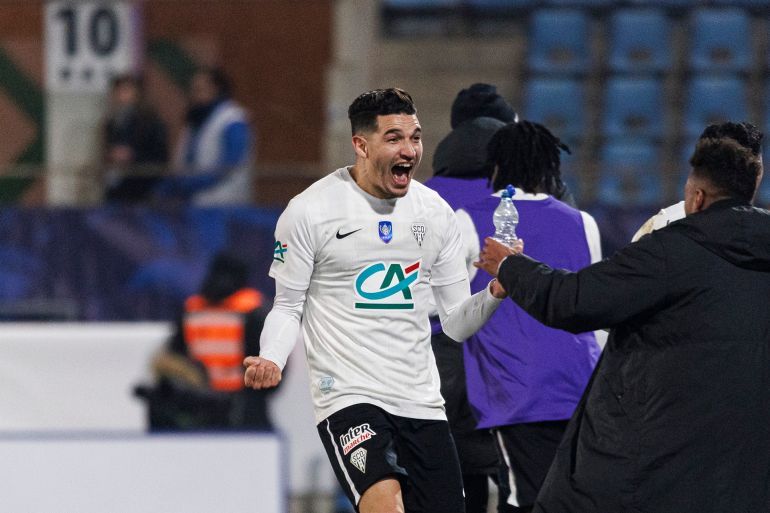 STRASBOURG, FRANCE - FEBRUARY 5: Zinedine Ferhat of Angers celebrates his teammate Farid El Mellali's goal during the French Cup match between Strasbourg and Angers on February 5, 2025 in Strasbourg, France. (Photo by Elyxandro Cegarra/Eurasia Sport Images/Getty Images)