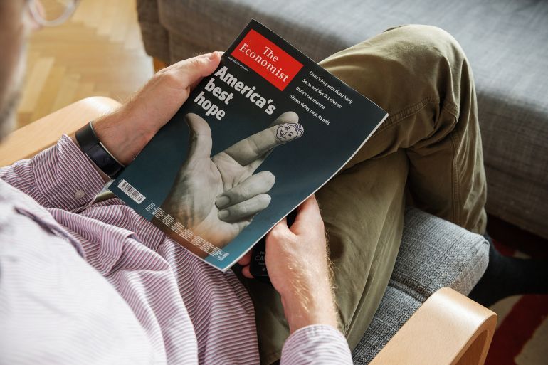 PARIS, FRANCE - NOV 10, 2016: Man reading The Economist magazine with America Best Hope cover illustrating US President Election - Donald Trump is the 45th President of United States of America; Shutterstock ID 514234612; purchase_order: aj; job: ; client: ; other: