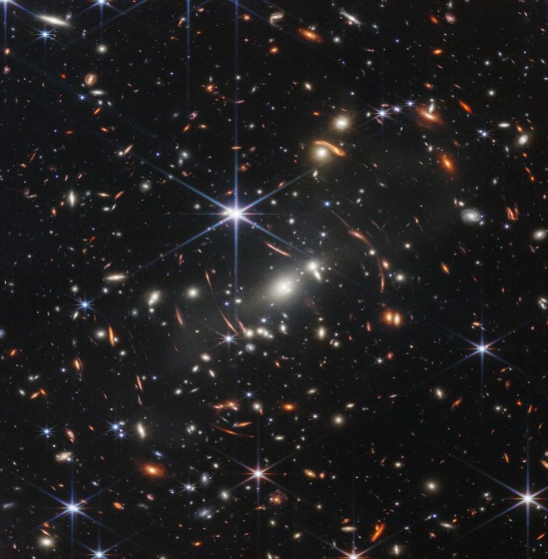 In this handout photo from NASA obtained on July 11, 2022, the first infrared image from the James Webb Space Telescope (JWST) is seen. - The JWST is the most powerful telescope launched into space and it reached its final orbit around the sun, approximately 930,000 miles from Earths orbit, in January, 2022. The technological improvements of the JWST and distance from the sun will allow scientists to see much deeper into our universe with greater detail. (Photo by Handout / NASA / AFP) / RESTRICTED TO EDITORIAL USE - MANDATORY CREDIT 