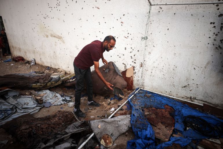 A Palestinian man checks the destroyed Al Jazeera tent at Al-Shifa Hospital in Gaza City, Palestine, on August 11, 2025, following an overnight strike by the Israeli military. Qatari broadcaster Al Jazeera says on August 11 that five of its journalists are killed in an Israeli strike, including a prominent reporter. The Israeli military acknowledges in a statement targeting correspondent Anas al-Sharif, accusing him of being a ''terrorist'' affiliated with Hamas. (Photo by Majdi Fathi/NurPhoto via Getty Images)
