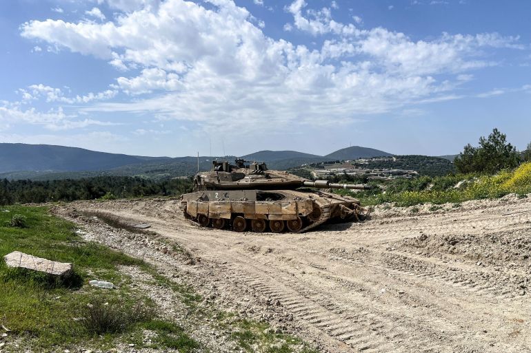 FILE PHOTO: An Israeli tank is positioned on the Israeli side of the Israel-Lebanon border, March 18, 2025 REUTERS/Avi Ohayon/File Photo
