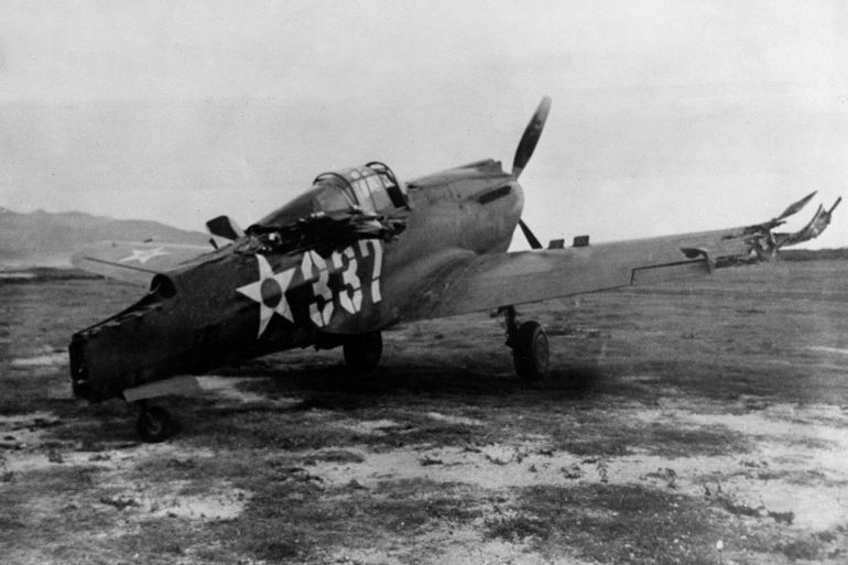 In this photo provided by the U.S. Army, its tail shot off in Japan's surprise attack on Hickam Field near Honolulu, Hawaii on Dec. 7, this P-40 pursuit plane never got off the ground to strike back, shown Dec. 16, 1941. (AP Photo/U.S. Army)