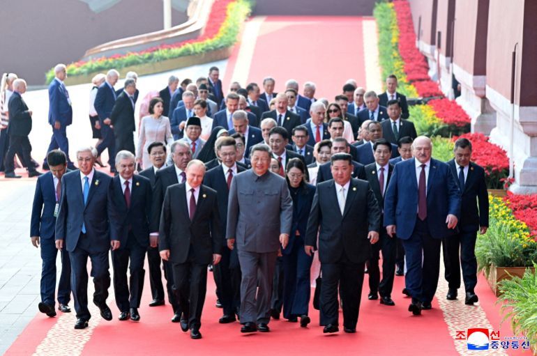 North Korean leader Kim Jong Un and Russian President Vladimir Putin walk with Chinese President Xi Jinping as they attend a military parade marking the 80th anniversary of the end of World War Two, in Beijing, China, September 3, 2025, in this picture released by the Korean Central News Agency. KCNA via REUTERS ATTENTION EDITORS - THIS IMAGE WAS PROVIDED BY A THIRD PARTY. REUTERS IS UNABLE TO INDEPENDENTLY VERIFY THIS IMAGE. NO THIRD PARTY SALES. SOUTH KOREA OUT. NO COMMERCIAL OR EDITORIAL SALES IN SOUTH KOREA.