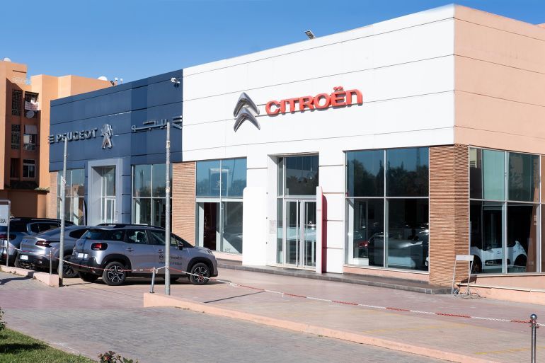 Peugeot and Citroën car dealership, modern architecture, automotive retail in urban setting, regional heritage and authentic oriental traditional architecture, Marrakech, Morocco - January 7, 2024 المصدر: أدوبي ستوك