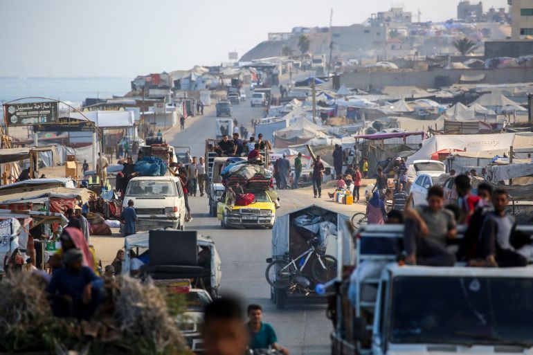 TOPSHOT - Palestinians transport their belongings as they evacuate Gaza City towards southern areas of the coastal Gaza Strip, on September 10, 2025. Israel's military said on September 9, it will act with 