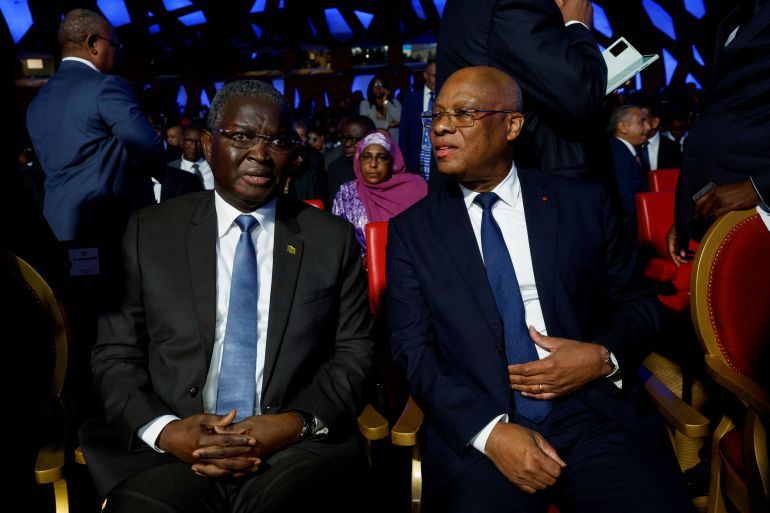 The governor of the Central Bank of West African States (BCEAO) Jean-Claude Kassi Brou speaks with the commission president of WAEMU/UEMOA (West African Economic and Monetary Union) Abdoulye Diop, during the swearing-in ceremony of Dr. Sidi Ould Tah as the 9th President of the African Development Bank Group at Sofitel Abidjan Hotel Ivoire, in Abidjan, Ivory Coast September 1, 2025. REUTERS/Luc Gnago