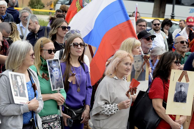 ROME, ITALY - MAY 4: Russian people and sympathizers gather in Piazza Ugo La Malfa to celebrate the Immortal Regiment on the anniversary of the Soviet victory over Nazi Germany with photos of the fighters, Soviet banners and St George's ribbon on May 4, 2025 in Rome, Italy. The event, which started in Russia on the fringes of Victory Day (on May 9), celebrates Russia's defeat of Nazism and aims to