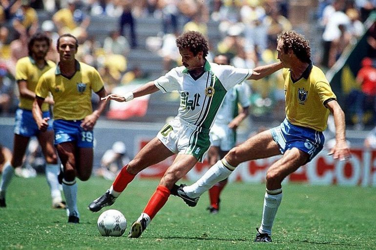 1986 World Cup Finals, Guadalajara, Mexico, 6th June, 1986, Brazil 1 v Algeria 0, Brazil's Falcao battles for the ball with Algeria's Lakhdar Belloumi (Photo by Bob Thomas Sports Photography via Getty Images)