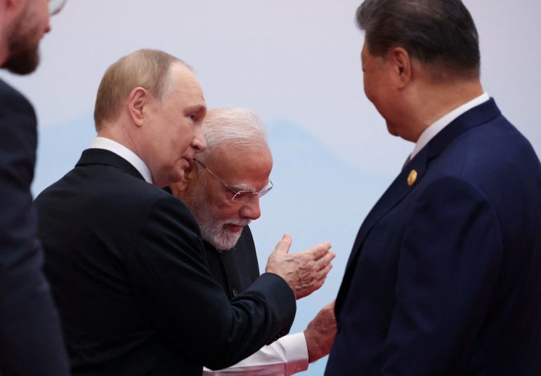 Chinese President Xi Jinping, Indian Prime Minister Narendra Modi and Russian President Vladimir Putin speak during a meeting at the Shanghai Cooperation Organisation (SCO) summit in Tianjin, China, September 1, 2025. Sputnik/Alexander Kazakov/Pool via REUTERS ATTENTION EDITORS - THIS IMAGE WAS PROVIDED BY A THIRD PARTY.