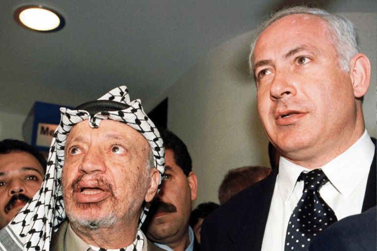 Palestinian Authority President Yasser Arafat (left) and Prime Minister Benjamin Netanyahu after their meeting in Davos on 2 February 1997. (AP Photo/Patrick Aviolat)