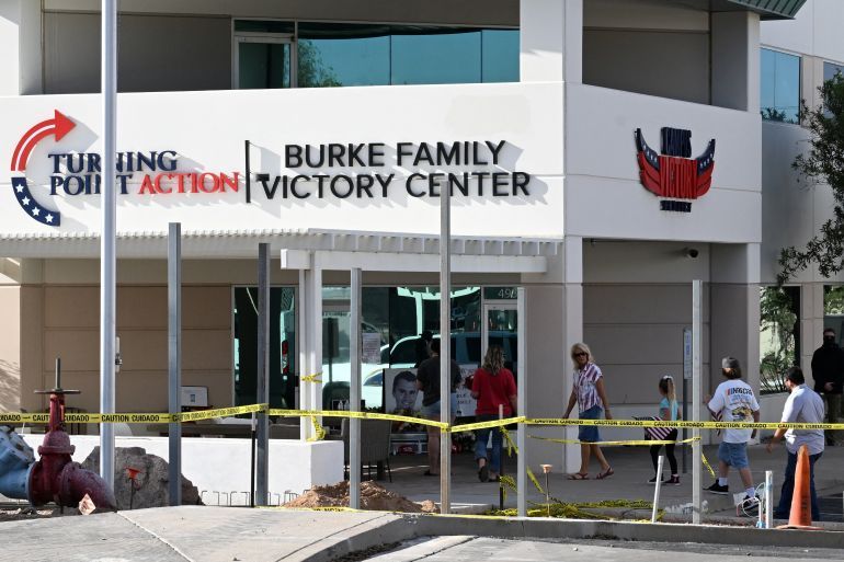 Mourners bring flags and flowers to a memorial for Charlie Kirk, who was shot and killed in Utah, at the Turning Point headquarters in Phoenix, Arizona, U.S. September 10, 2025. REUTERS/Caitlin O’Hara