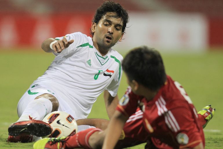 Iraqi player Nashat Akram (L) fight for the ball with Lui Jia Nye of China during their 2014 FIFA World Cup football qualifying round in Doha, on November 11, 2011