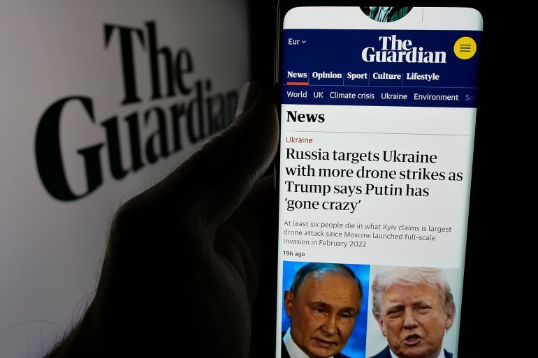 Stuttgart, Germany - 05-27-2025: Person holding smartphone with web page of British newspaper company The Guardian on screen in front of logo. Focus on center of phone display. Unmodified photo.; Shutterstock ID 2637860747; purchase_order: AJA; job: ; client: ; other: