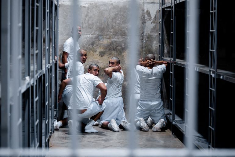 Alleged members of the Venezuelan gang Tren de Aragua and the MS-13 gang, recently deported by the U.S. government, look on from inside a jail at the Terrorism Confinement Center (CECOT) prison, in Tecoluca, El Salvador April 12, 2025. Secretaria de Prensa de la Presidencia/Handout via REUTERS ATTENTION EDITORS-THIS IMAGE HAS BEEN SUPPLIED BY A THIRD PARTY. NO RESALES. NO ARCHIVES