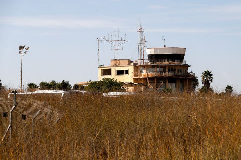 A picture shows the main building of the former Atarot airport (Jerusalem International Airport), which has been closed to civilian traffic since the breakout of the second Palestinian intifada (uprising) in 2000, near the village of Qalandia between the West Bank city of Ramallah and Israel-annexed east Jerusalem on November 25, 2021. (Photo by AHMAD GHARABLI / AFP)